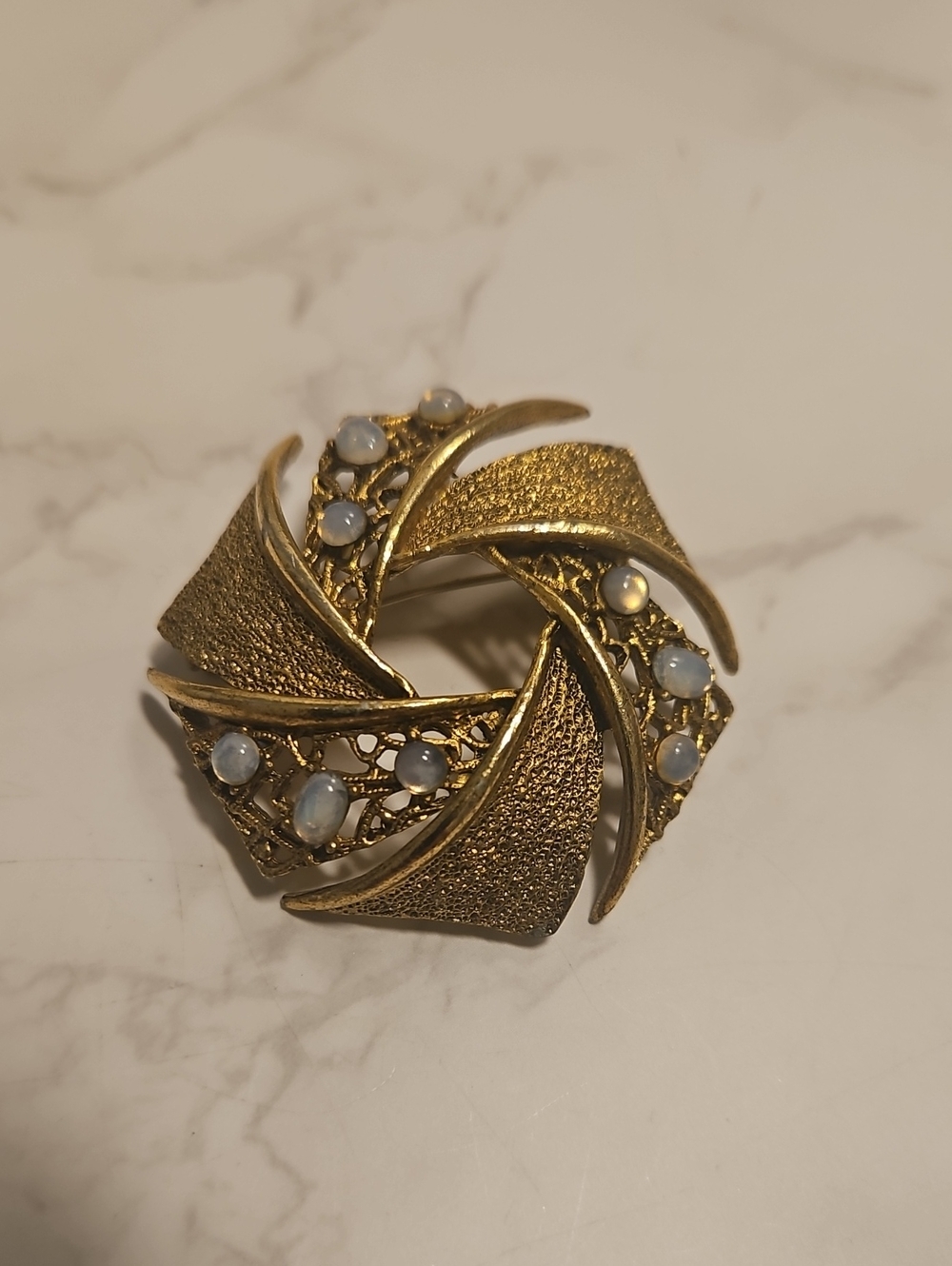 Vintage Pinwheel Goldtone Brooch With Stones